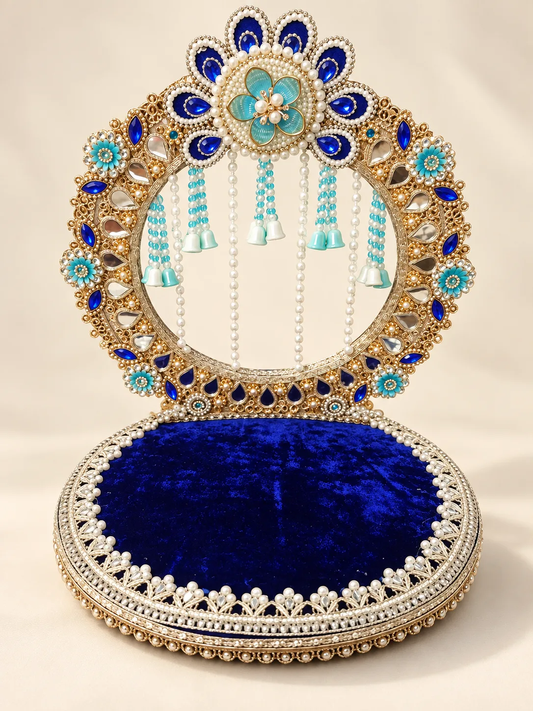 Blue velvet and pearl singhasan with a turquoise floral crown