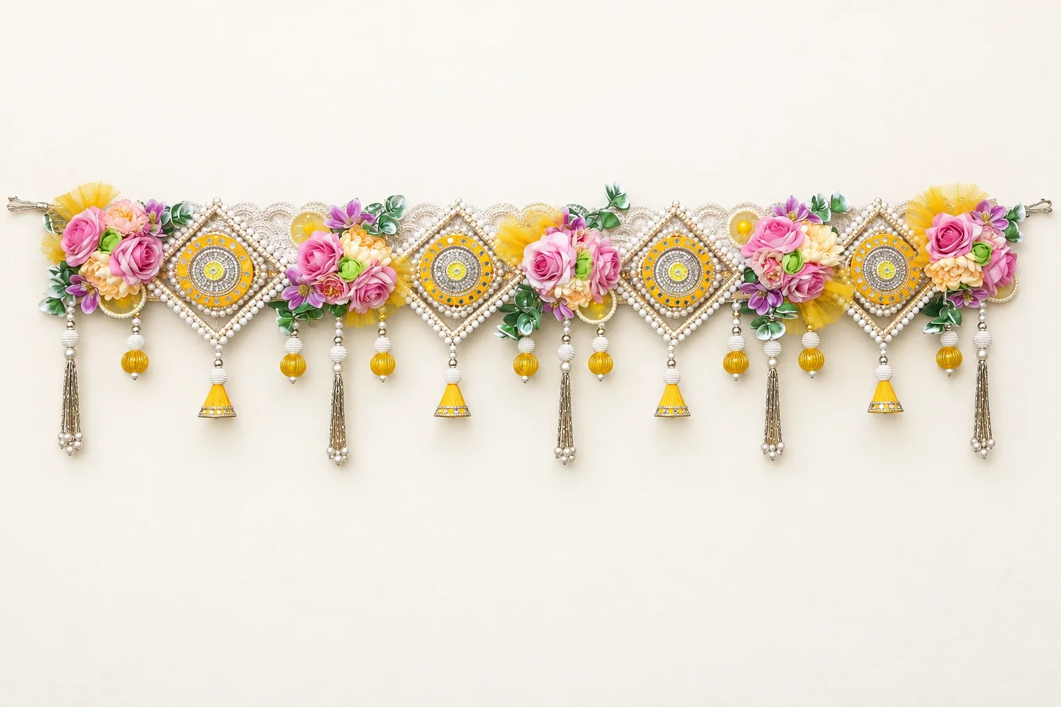 Yellow and pink floral bandhanwar shown in full on a light background
